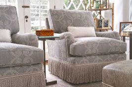 Enchanting Hamptons getaway, featuring our custom upholstered Bleeker Bridgewater club chair with a swivel base and traditional style. Interiors: Penny Drue Baird/Dessins LLC