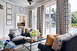 Nautical Hampton's home featuring our custom Bleeker Bridgewater Club Chair shown with a  navy blue wicker frame and upholstered cushions. Upholstery: Bespoke by Luigi Gentile. Interior designer: Scott Salvator 