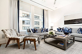 Elegant and contemporary styled  grey and blue living room featuring our custom swivel chair, custom Whitehall Sofa and functional coffee table with a lower shelf. Upholstery by Bespoke by Luigi Gentile. Room designed by Gale Sitomer. 