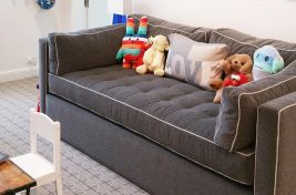 A perfect playroom featuring our custom upholstered Chambers Hi-Riser with a pull out trundle bed. Interiors by Nina Wexler.
