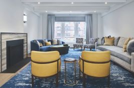 Beautiful living room on the Upper East Side featuring our custom Whitney Sofa in blue, custom Sunny Chairs in yellow fabric and custom nesting tables. Upholstery by Bespoke by Luigi Gentile. Interiors: Gale Sitomer. Photography: Alex Kroke