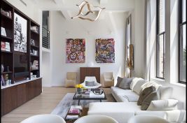 Beautiful sun drenched living room with a custom left arm facing sectional with a wooden tray created by Bespoke by Luigi Gentile. Designer: Rona Landman 