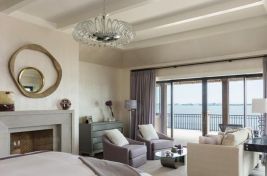 Master bedroom sitting area featuring custom swivel club chairs by Bespoke by Luigi Gentile. Designer: Penny Drue Baird/Dessins LLC. 