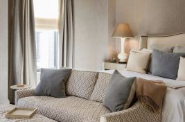 Elegant custom sofa with half moon custom upholstered ottoman for a fabulous Master Bedroom by designer, Penny Drue Baird/Dessins LLC. Upholstery: Bespoke by Luigi Gentile. 